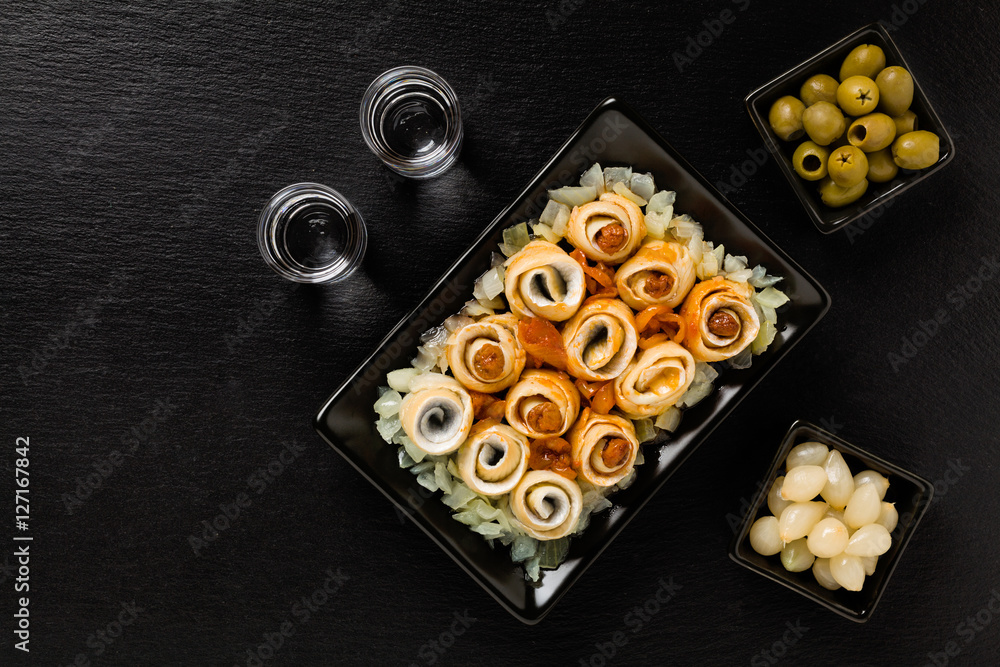 Rolled herring in olive, served with onions. Perfect for vodka. Rolled herring in olive, served with onions. Perfect for vodka.