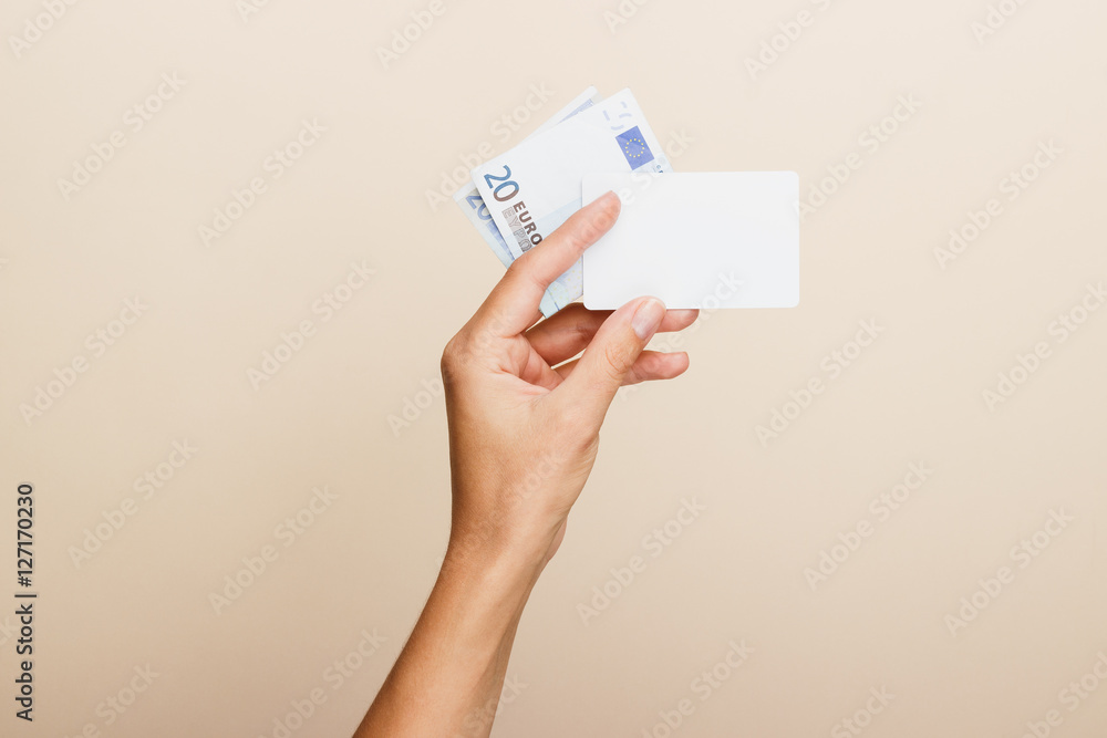 Woman's hand with money on a light background Woman's hand with money on a light background