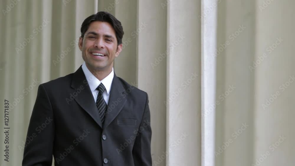 MS SELECTIVE FOCUS Portrait of businessman standing next to columns / Singapore MS SELECTIVE FOCUS Portrait of businessman standing next to columns / Singapore