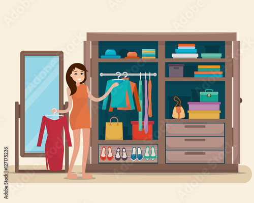 Woman near wardrobe for cloths with mirror.