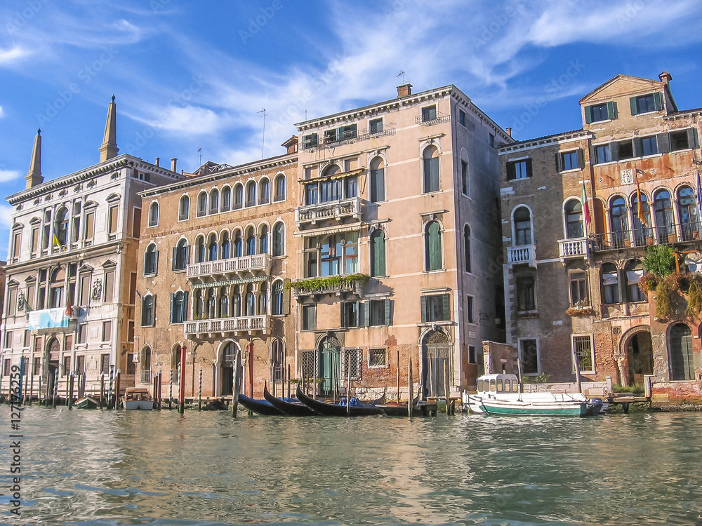 Boats and gondolas in Venetian Canal Grande. Venice, Italy.