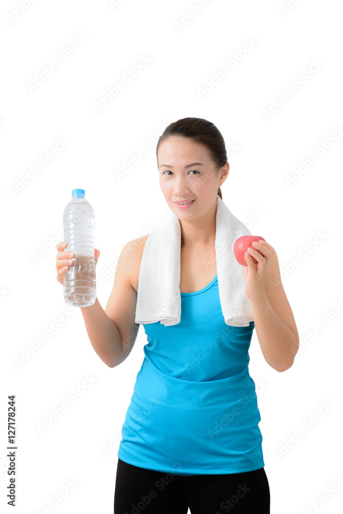 Fitness woman happy smiling holding apple and water bottle Fitness woman happy smiling holding apple and water bottle