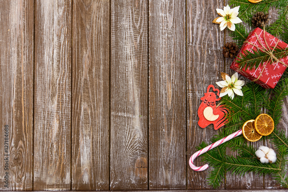 Christmas background with decorations and gift boxes on wooden board Christmas background with decorations and gift boxes on wooden board