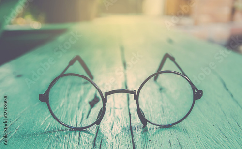Artwork in retro style, Spectacles and book , vintage styled