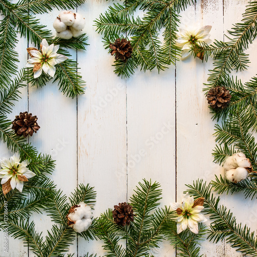 Christmas wooden background with fir tree and decoration