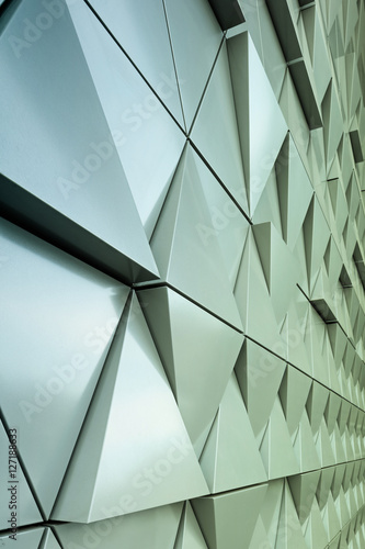 Abstract close-up view of modern aluminum ventilated triangles on facade 