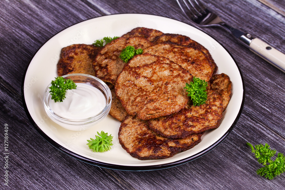 Liver Patties with Sour Cream and Parsley. Liver Cakes or Fritters of Liver. Healthy snack or take-away lunch bites Liver Patties with Sour Cream and Parsley. Liver Cakes or Fritters of Liver. Healthy snack or take-away lunch bites