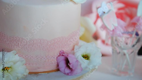 Cake for the first holy communion with cross on white background