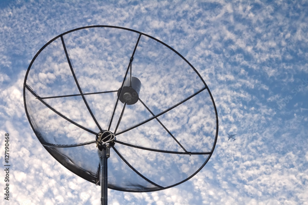 satellite dish with cloudy sky background