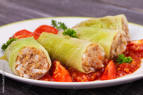 Cabbage rolls with meat, rice and vegetables in tomato sauce. Stuffed cabbage leaves with meat. Dolma, sarma, sarmale, golubtsy or golabki - traditional and popular dish in many countries