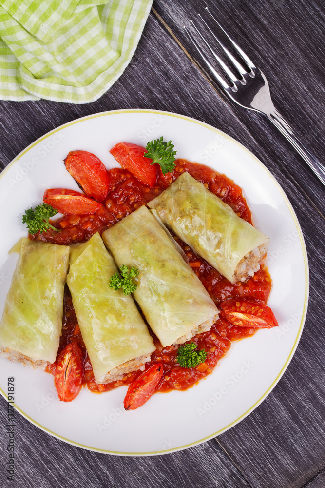 Cabbage rolls with meat, rice and vegetables in tomato sauce. Stuffed cabbage leaves with meat. Dolma, sarma, sarmale, golubtsy or golabki - traditional dish in many countries