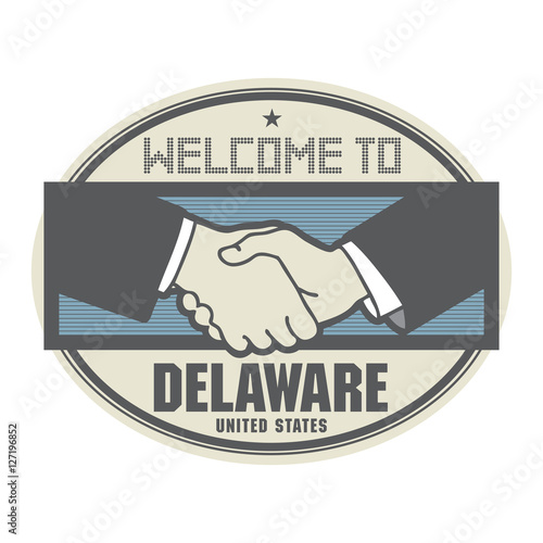 Business concept with handshake and the text Welcome to Delaware