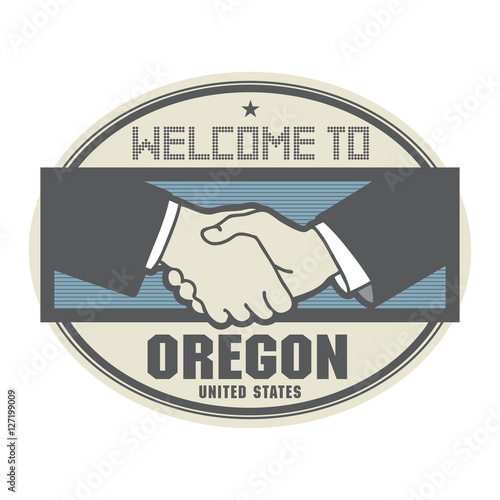 Business concept with handshake and the text Welcome to Oregon,