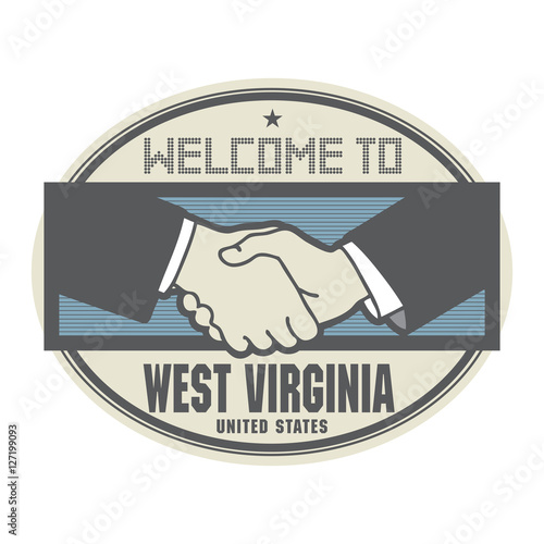 Business concept with handshake and text Welcome to West Virginia