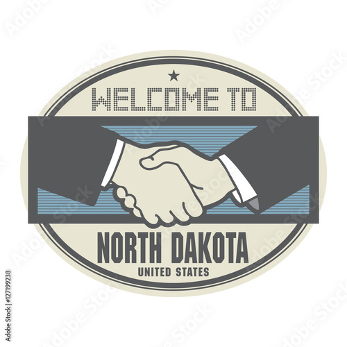 Business concept with handshake and text Welcome to North Dakota