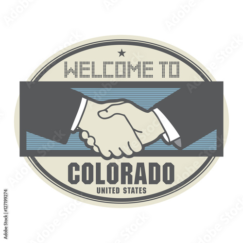 Business concept with handshake and the text Welcome to Colorado