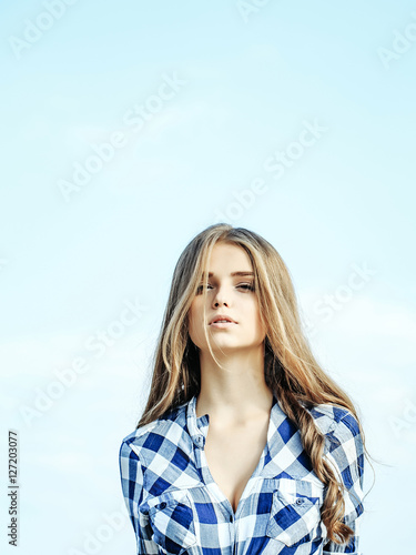 Pretty girl in blue sky © Volodymyr
