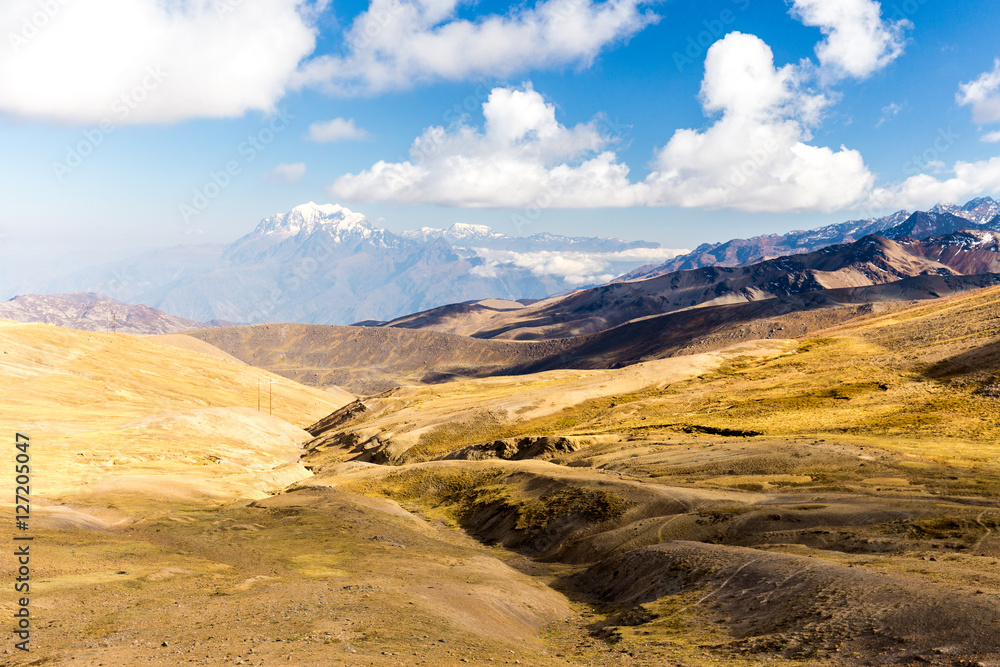 Illimani mountain peak covered snow valley landscape road Bolivia. 