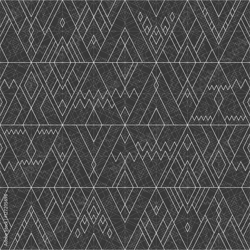 Vector seamless white geometric line pattern of triangles and rhombus on black dark background in hipster style.