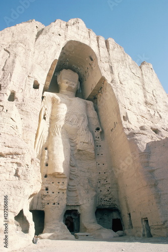 Defaced statue of the Buddha, 55m tall, carved in cliff by monks, since destroyed by the Taliban, Bamiyan, Afghanistan photo