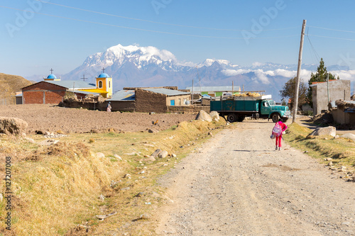 Wallpaper Mural Girl pupil walking village road Bolivia mountains church building. Torontodigital.ca