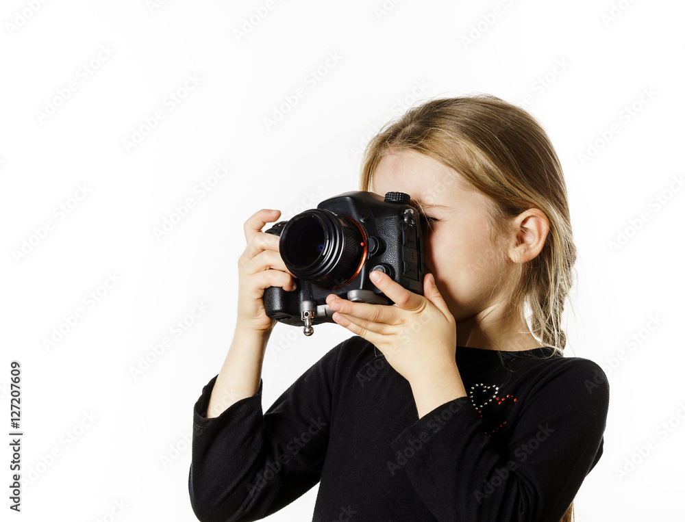 Little girl taking pictures by professional digital camera Little girl taking pictures by professional digital camera