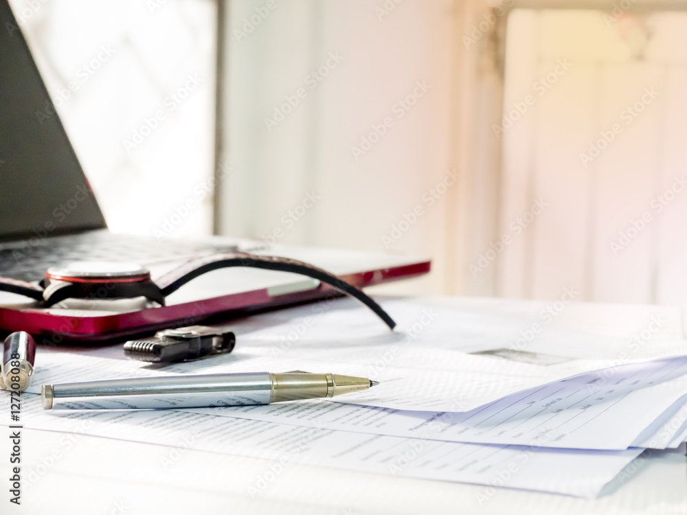 Close up of modern working table of businessman with notebook, p Close up of modern working table of businessman with notebook, p