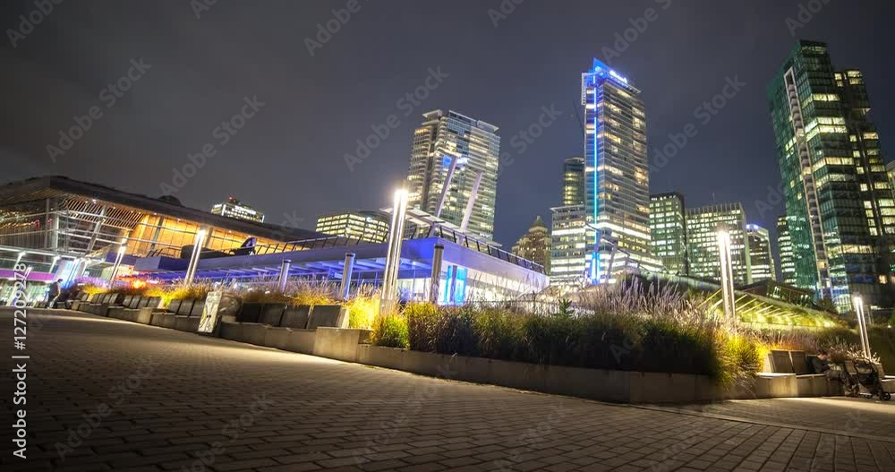 Vancouver, British Columbia, Canada - view from seaplane flight pier to illuminated downtown Vancouver at night - Timelapse with motion and zoom out Vancouver, British Columbia, Canada - view from seaplane flight pier to illuminated downtown Vancouver at night - Timelapse with motion and zoom out