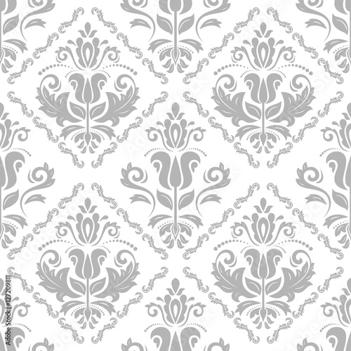 Oriental classic pattern. Seamless abstract background with repeating elements. Light gray and white pattern