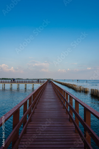 Wooden beach walkway in the evening, a nature trail in Bangkok, Thailand.