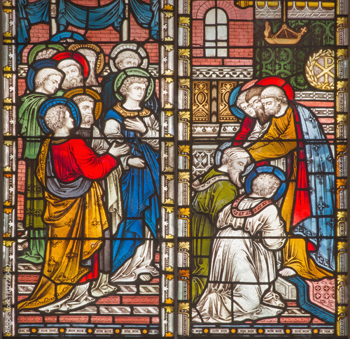 ROME, ITALY - MARCH 9. 2016: The Apostles giving the blessing to St. Paul and Barnabas in Jerusalem. The stained glass of All Saints' Anglican Church by workroom Clayton and Hall (19. cent.) photo