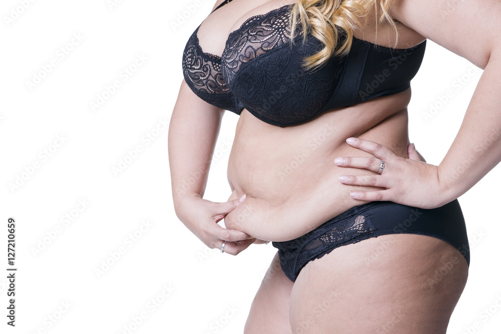 Plus size model in black lingerie, overweight female body, fat woman with  flabby stomach isolated on white background Stock Photo