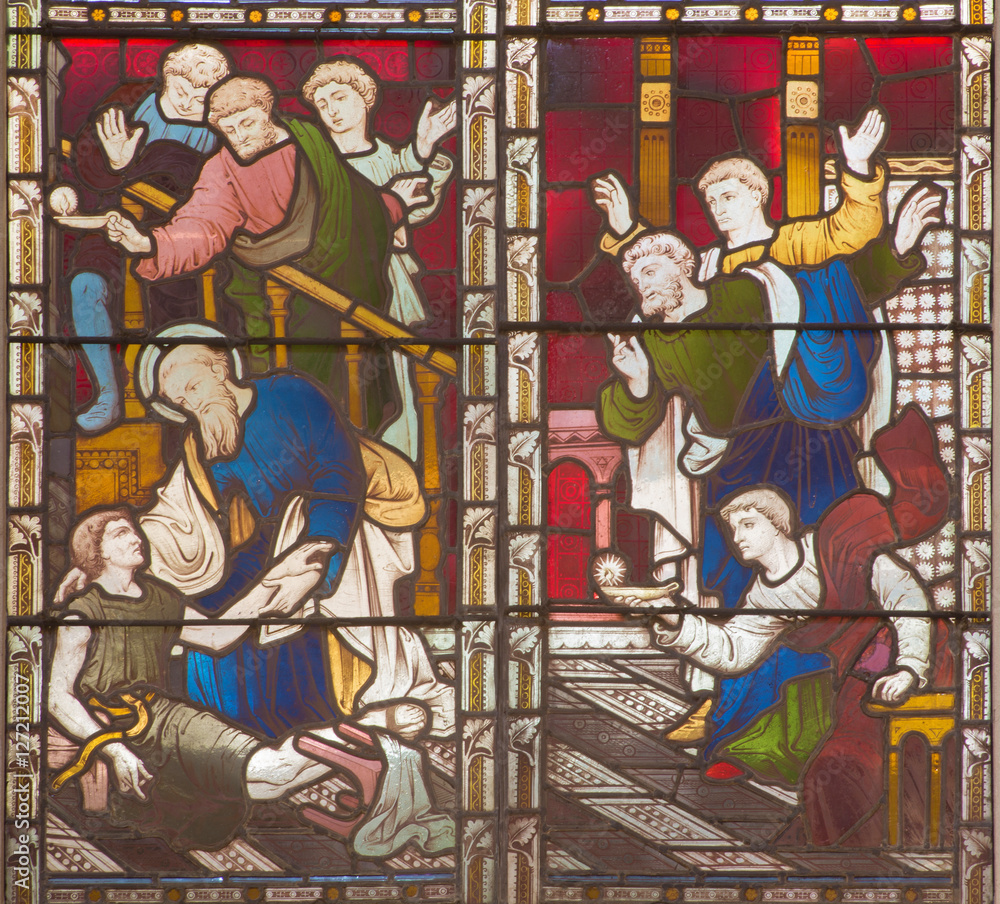 ROME, ITALY - MARCH 9. 2016: The scene St. Paul resurrection of Eutychus in Troas on the stained glass of All Saints' Anglican Church by workroom Clayton and Hall (19. cent.).