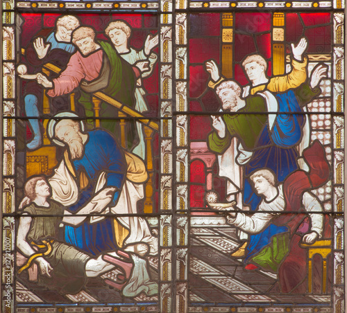 ROME, ITALY - MARCH 9. 2016: The scene St. Paul resurrection of Eutychus in Troas on the stained glass of All Saints' Anglican Church by workroom Clayton and Hall (19. cent.).
