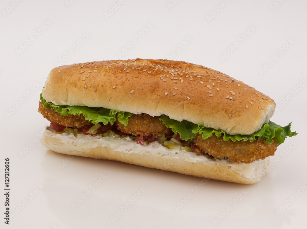 hamburger with cutlet and pickles on a white background with reflection hamburger with cutlet and pickles on a white background with reflection