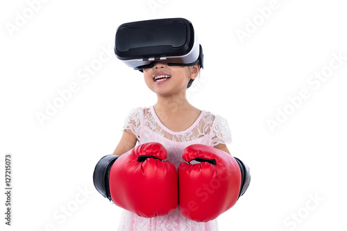 Asian Chinese little girl experiencing virtual reality with boxi photo