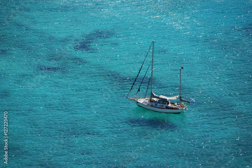 yacht sailing the turquoise sea waters - view from above