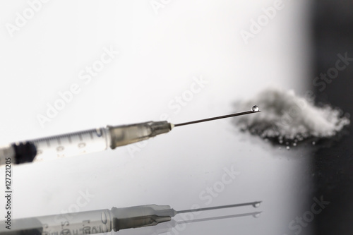 Bild auf Leinwand morphine or heroin drug liquid in syringe with narcotic powder and clear drop