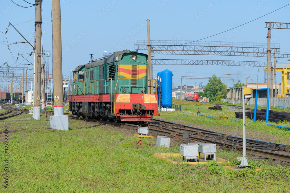 locomotive at a railway station in the summer locomotive at a railway station in the summer