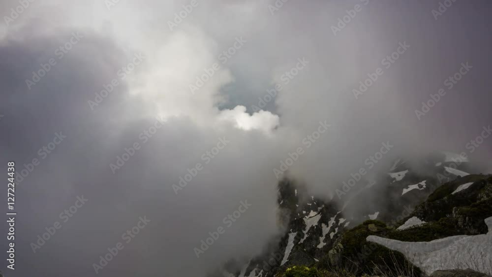 Big clouds over the snow-capped mountain peaks, timelapse Big clouds over the snow-capped mountain peaks, timelapse