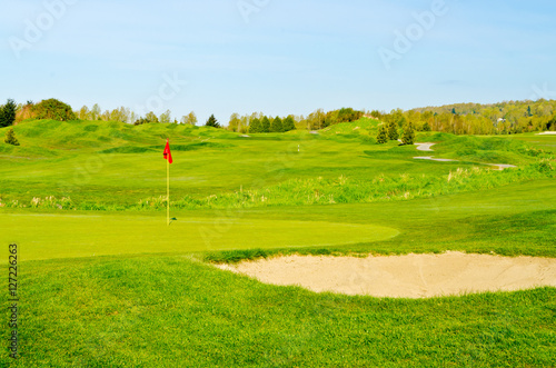Golf place with gorgeous green and blue sky view