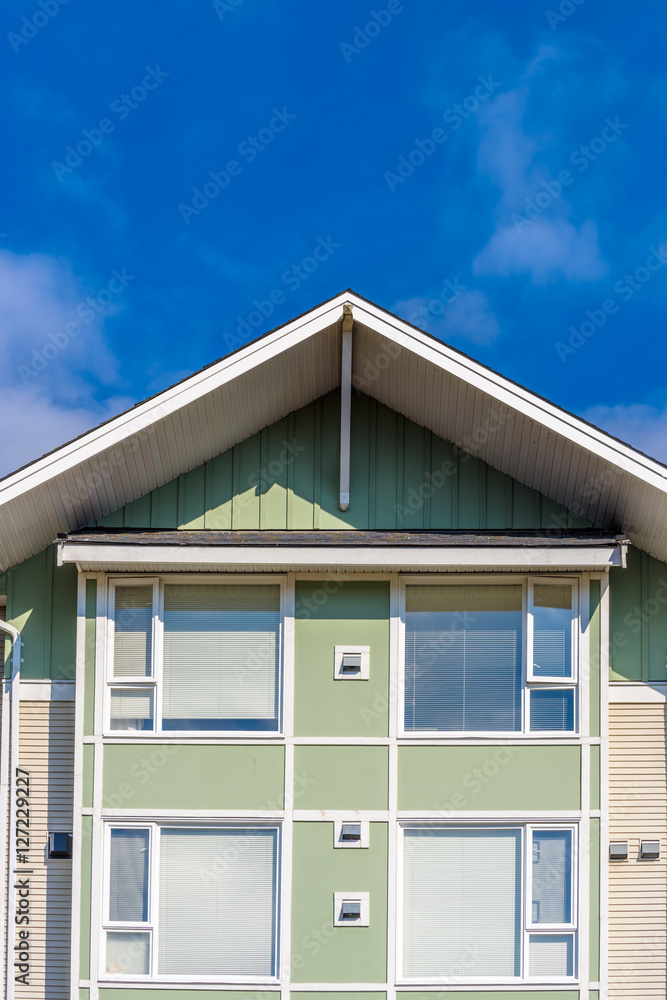 The top of the house or apartment building with nice window. The top of the house or apartment building with nice window.