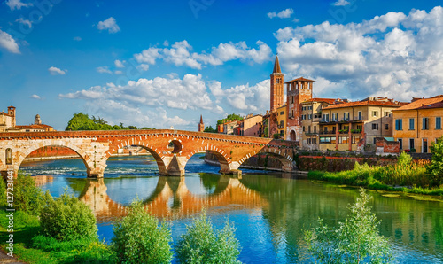 Bridge Ponte Pietra in Verona on Adige river photo