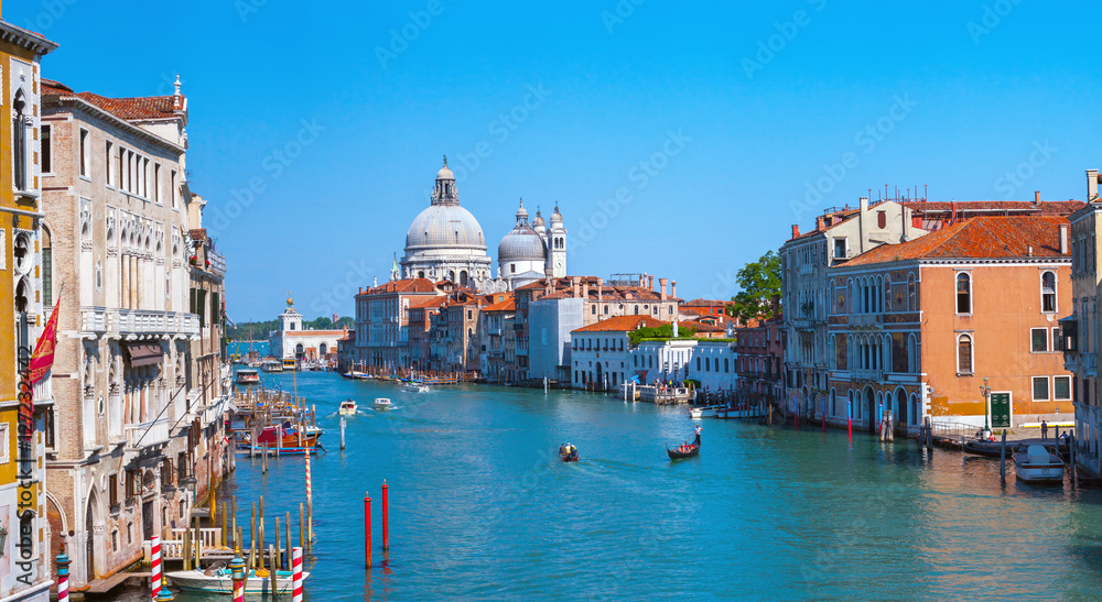 Panoramic view of famous Canal Grande and Basilica di Santa Maria della Salute in Venice, Italy.