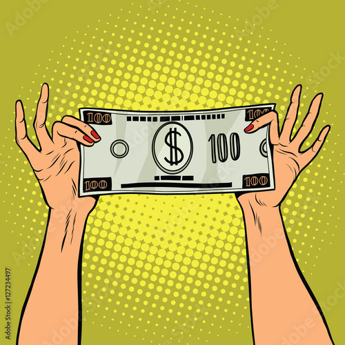 Female hands holding a hundred dollar bill