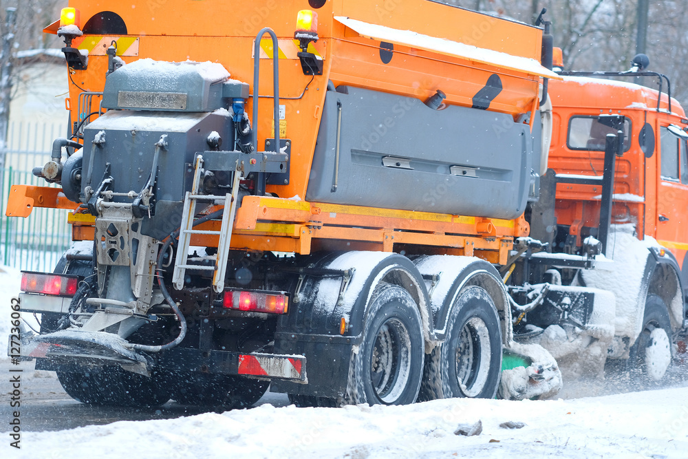 Moscow, Russia - November, 12, 2016: Snow removal machine on a snow-covered road after high snow-storm in Moscow, Russia