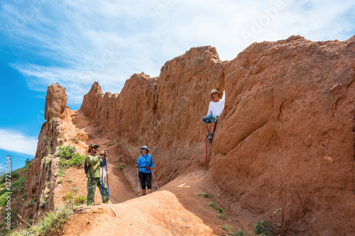 A group of tourists in Fairy Tale canyon, Kyrgyzstan.