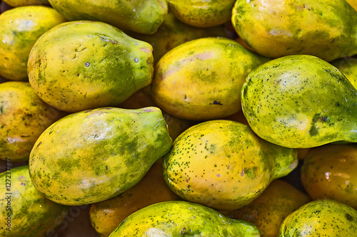 Tropical Hawaiian papaya fruit at farmers market closeup