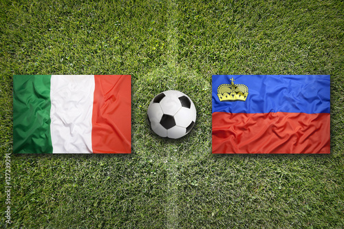 Italy vs. Liechtenstein flags on soccer field