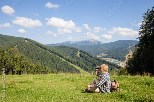 Young traveler enjoying mountain view © Nickolay Khoroshkov